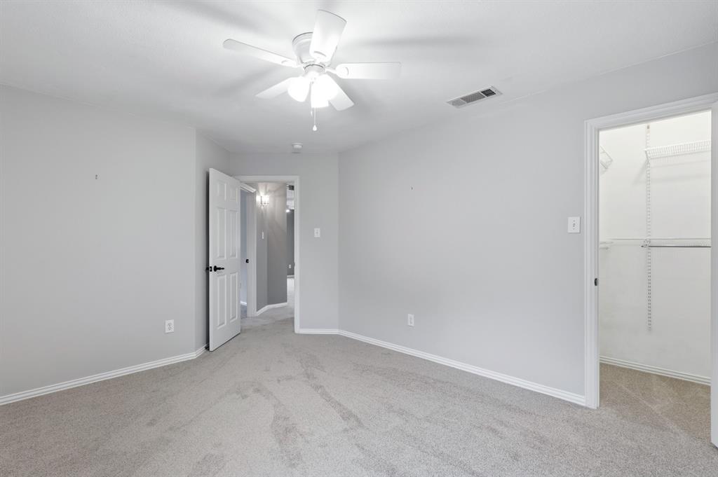 913 Cross Plains Drive Allen, TX 75013 - Photo 32 of 40 an empty room with fan and entrance