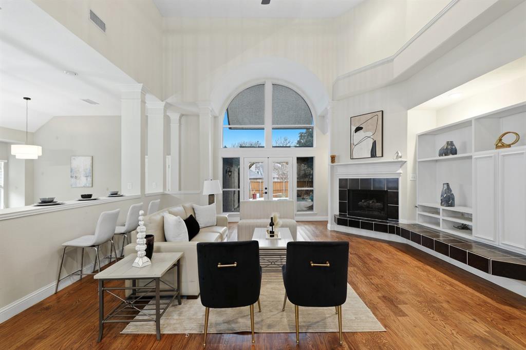 913 Cross Plains Drive Allen, TX 75013 - Photo 9 of 40 a living room with furniture a fireplace a rug and a window