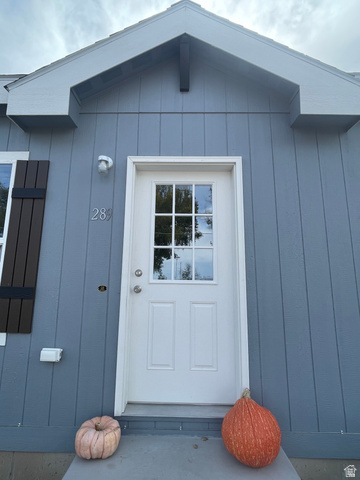 289 West Center Street Hinckley, UT 84635 - Photo 4 of 13 Light blue board and batten siding with white trim