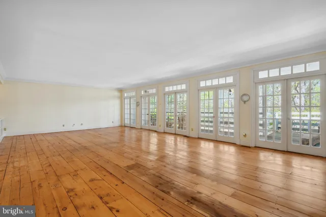 a view of an empty room with wooden walls
