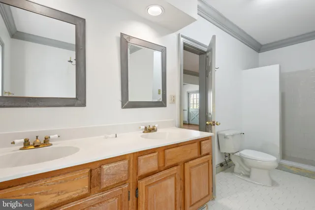 a kitchen with a refrigerator sink and cabinets