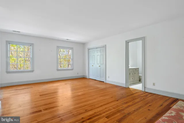 a aerial view of a house with a yard and lake view