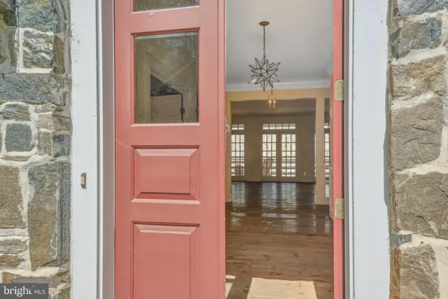a view of an empty room with glass door