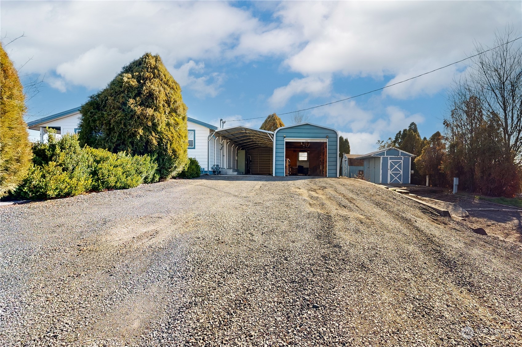 446 North 3rd Street Athena, OR 97813 - Photo 17 of 22 a front view of a house with a yard and garage