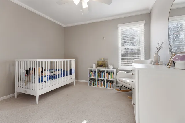 a view of a bedroom with windows