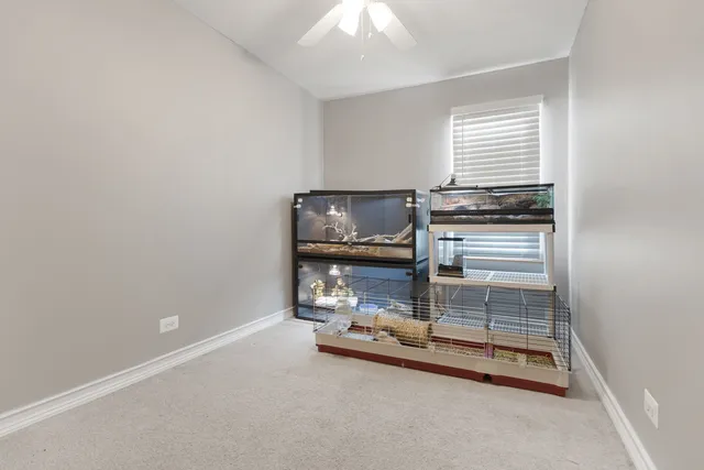 a room with gym equipment and view of living room