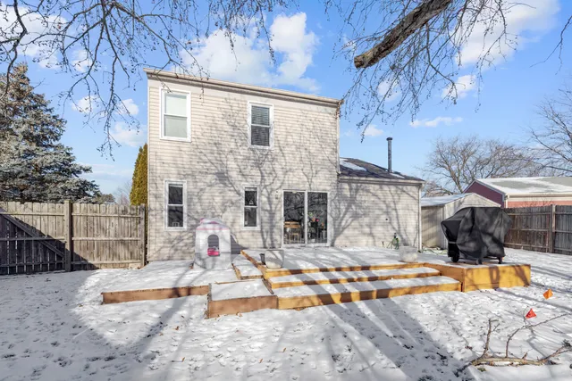 a view of a backyard with swimming pool