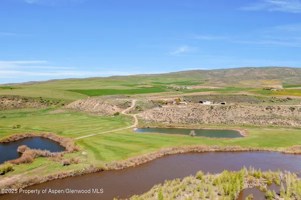 a view of a water with an ocean beach
