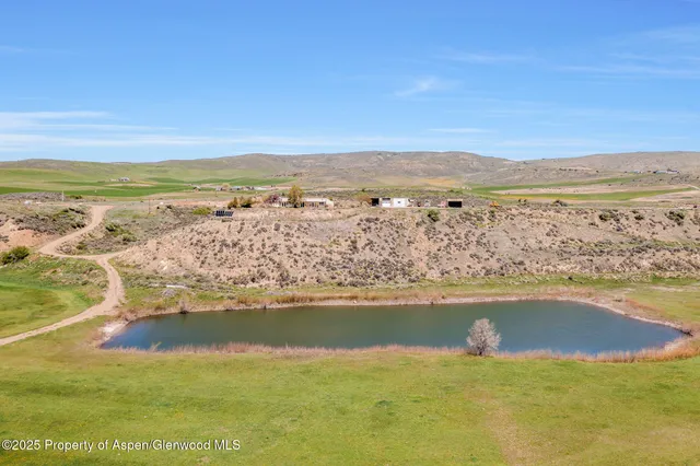 an aerial view of residential building and ocean view