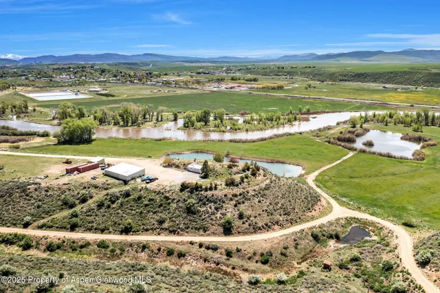 a kitchen with sink stove and cabinets