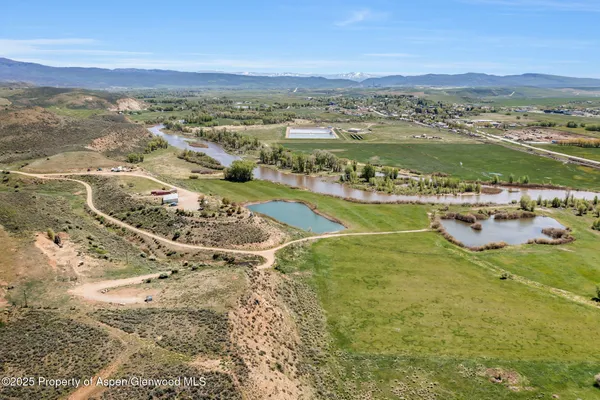a kitchen with a sink stove and white cabinets