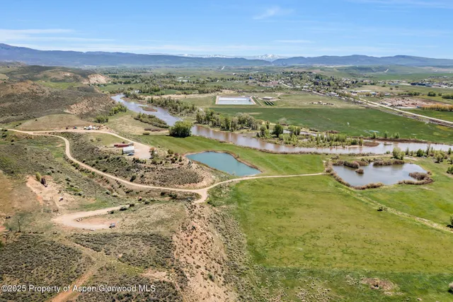 a kitchen with a sink stove and white cabinets