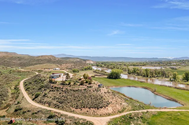 a view of a livingroom with furniture and cabinets