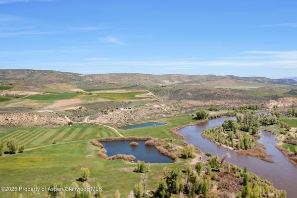 a view of an ocean and a mountain