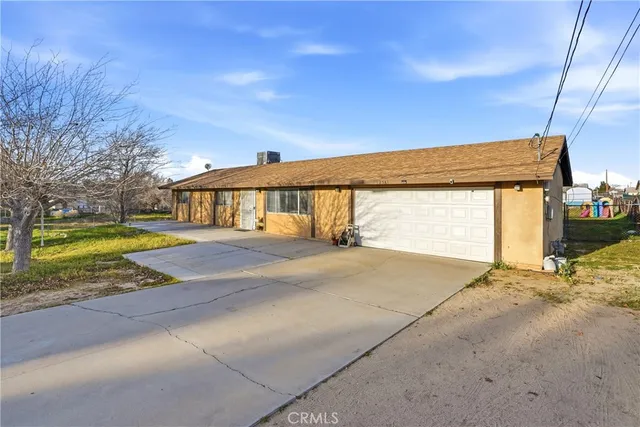 a view of garage with large tree
