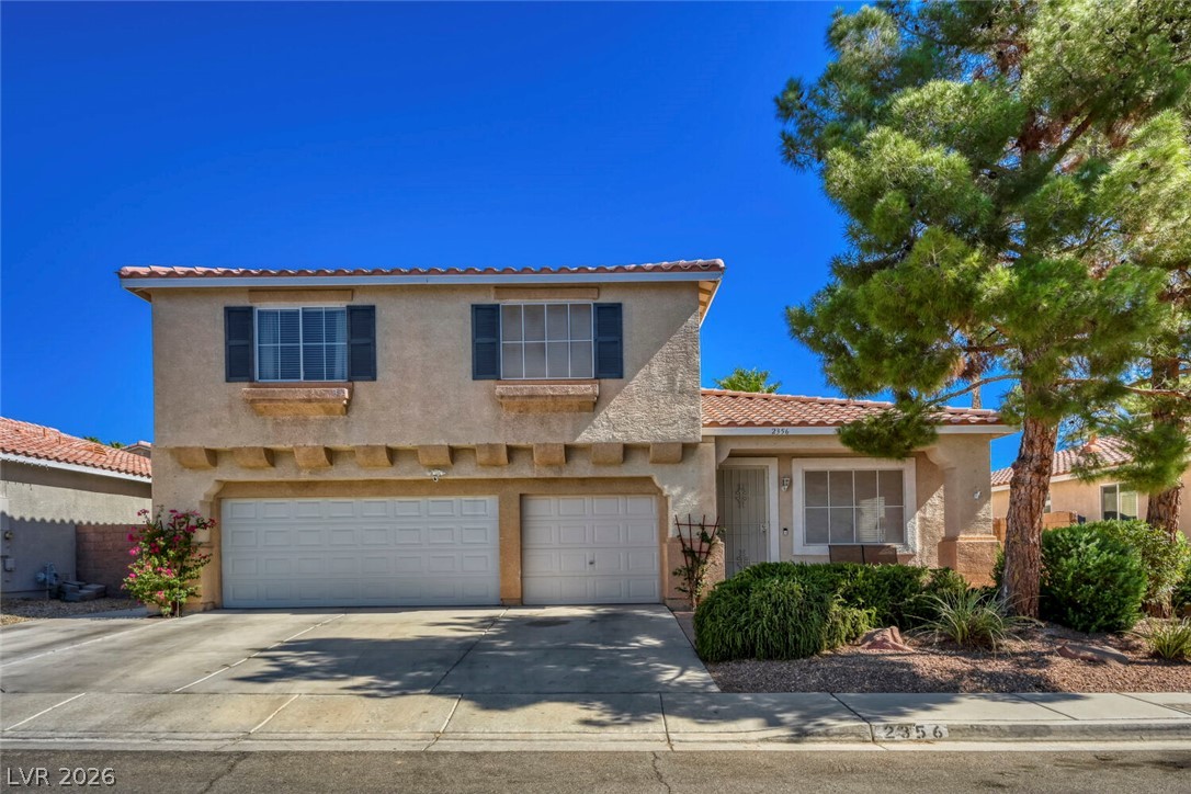 2356 Tilden Way Henderson, NV 89074 - Photo 2 of 30 A charming two-story home with desert-friendly landscaping welcomes you with its inviting facade.