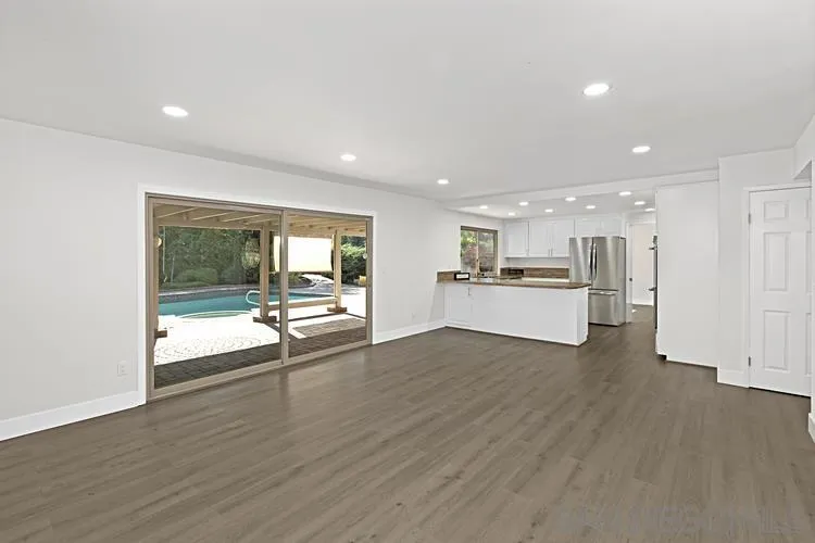 4334 Corral Canyon Road Bonita, CA 91902 - Photo 14 of 32 a view of a kitchen with a sink and wooden floor