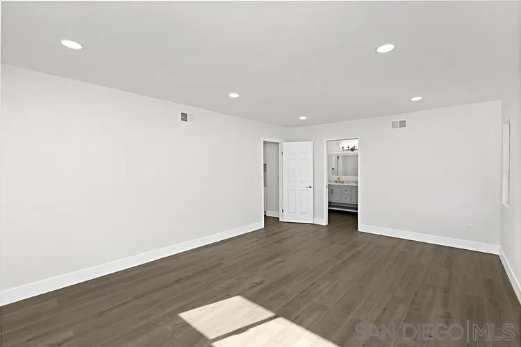 4334 Corral Canyon Road Bonita, CA 91902 - Photo 22 of 32 a view of an empty room with wooden floor