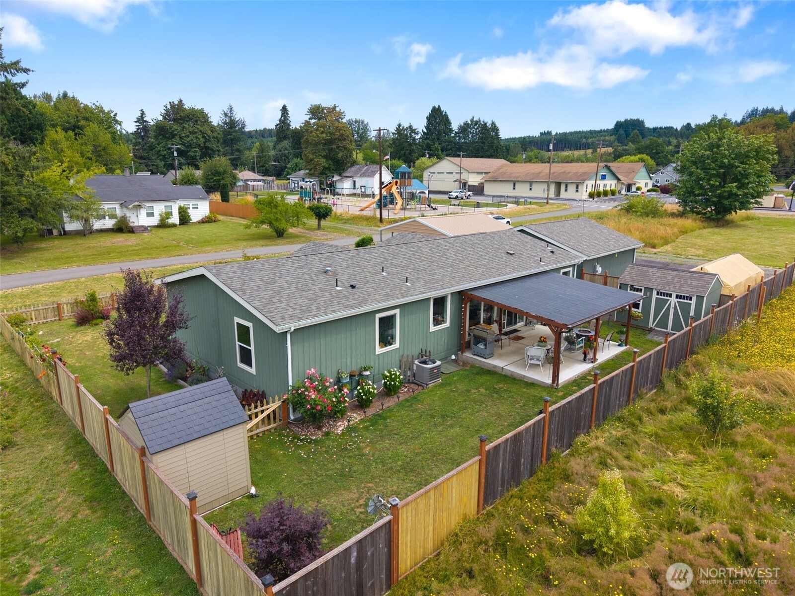 608 Main Street Vader, WA 98593 - Photo 33 of 37 a view of a house with pool and chairs