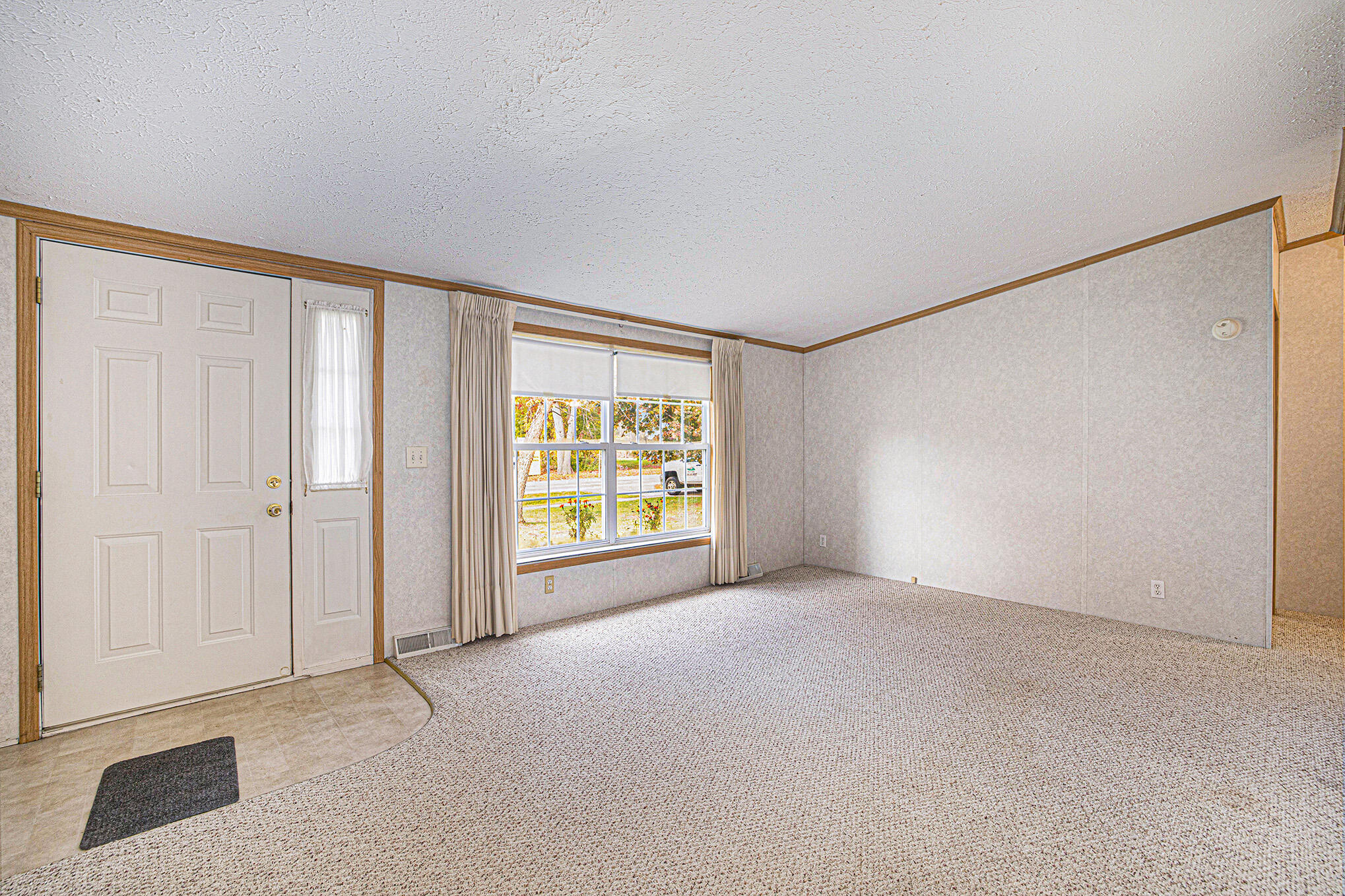 3349 Robinson Road Jackson, MI 49203 - Photo 3 of 22 3. Living Room and Front Entry
