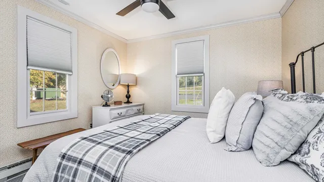 a bedroom with bed and window