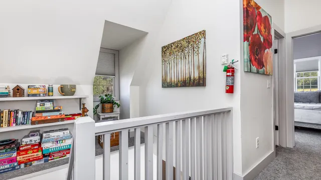 a view of a chairs and table in the back yard of the house