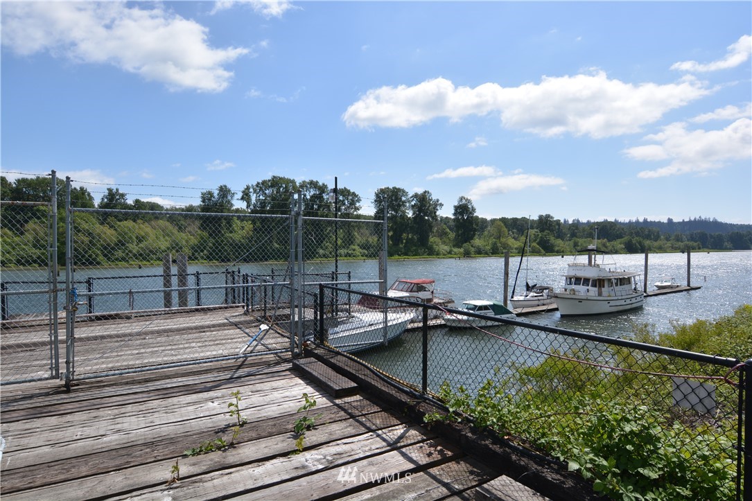 6400 B Willow Grove Road Longview, WA 98632 - Photo 7 of 26 a view of a lake with boats and a table