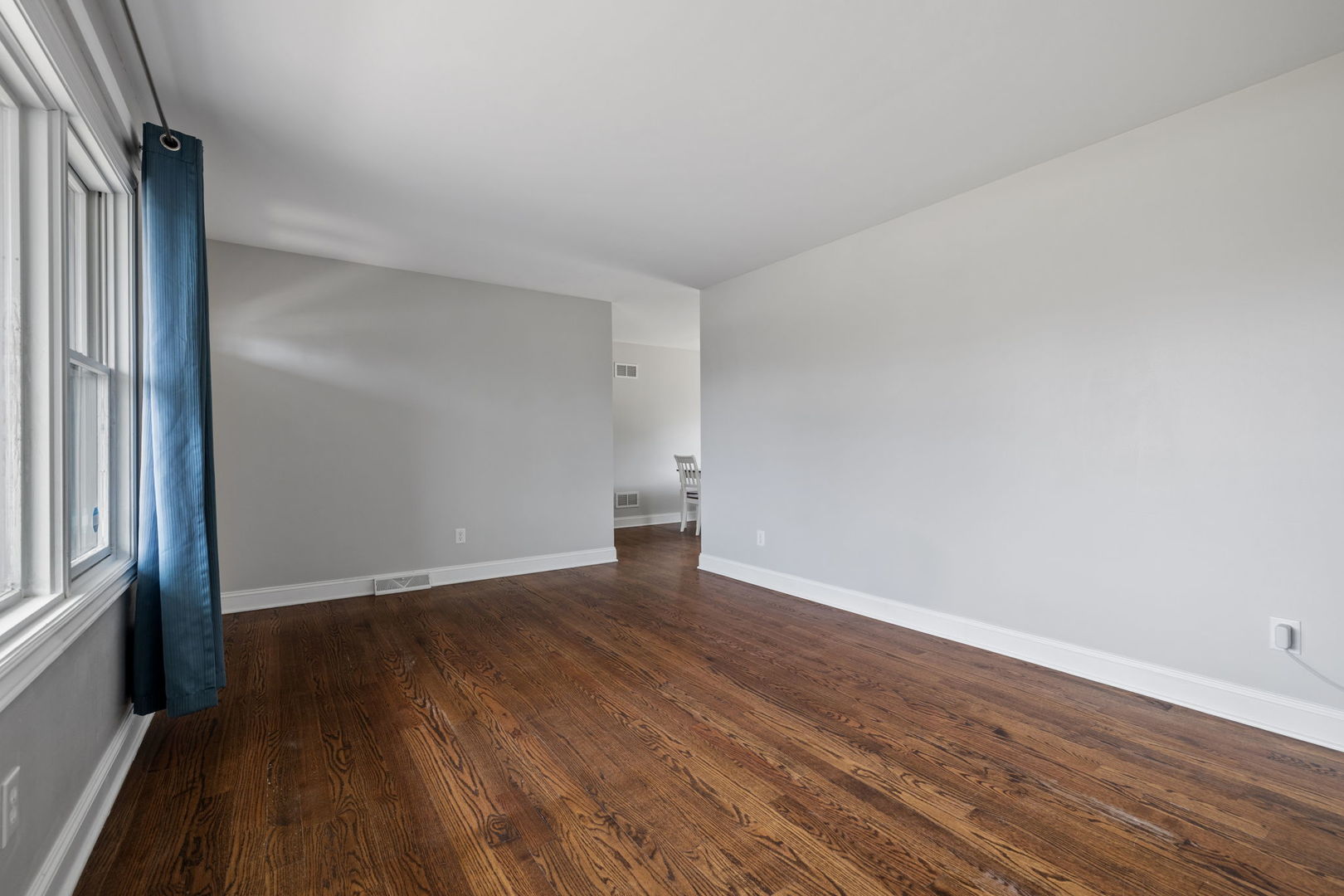 1024 South Cooper Road New Lenox, IL 60451 - Photo 3 of 22 an empty room with wooden floor and windows