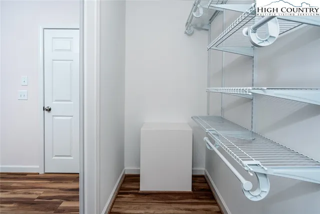 a view of storage and utility room with racks on the wall