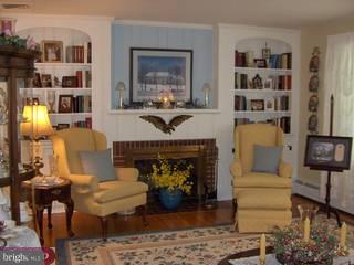 134 Coleman Road Hamilton, NJ 08690 - Photo 3 of 6 a living room with furniture and a fireplace