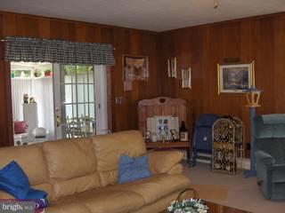 134 Coleman Road Hamilton, NJ 08690 - Photo 4 of 6 a living room with furniture and a large window