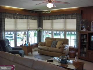 134 Coleman Road Hamilton, NJ 08690 - Photo 5 of 6 a living room with furniture and a large window