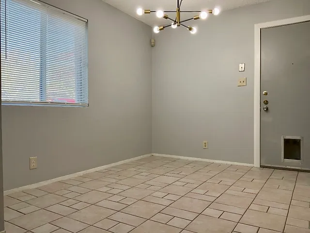 a view of a room that has a window in it