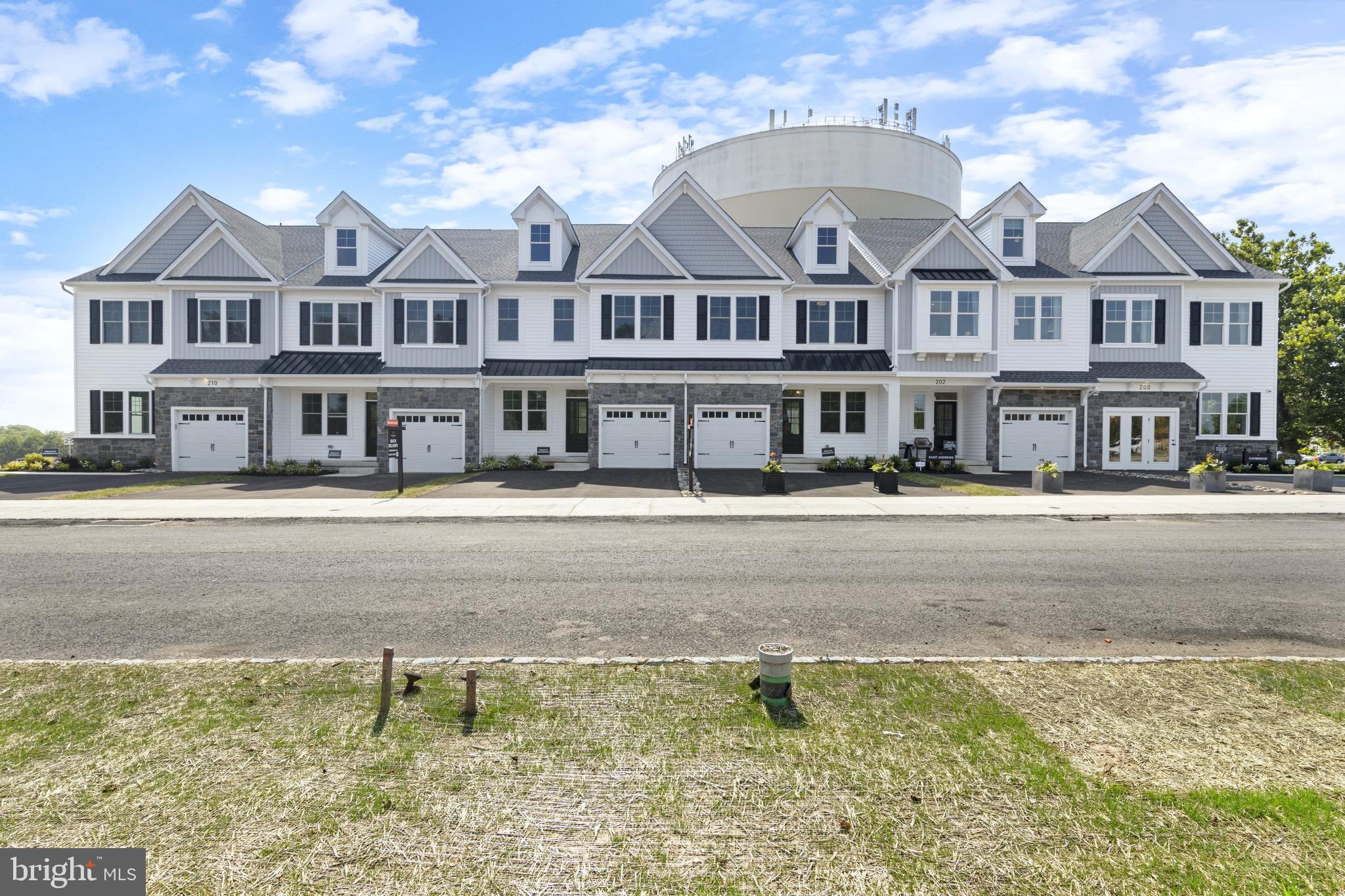 435 Reagans Lane, Unit 124 Chalfont, PA 18914 - Photo 2 of 8 a front view of residential houses with yard