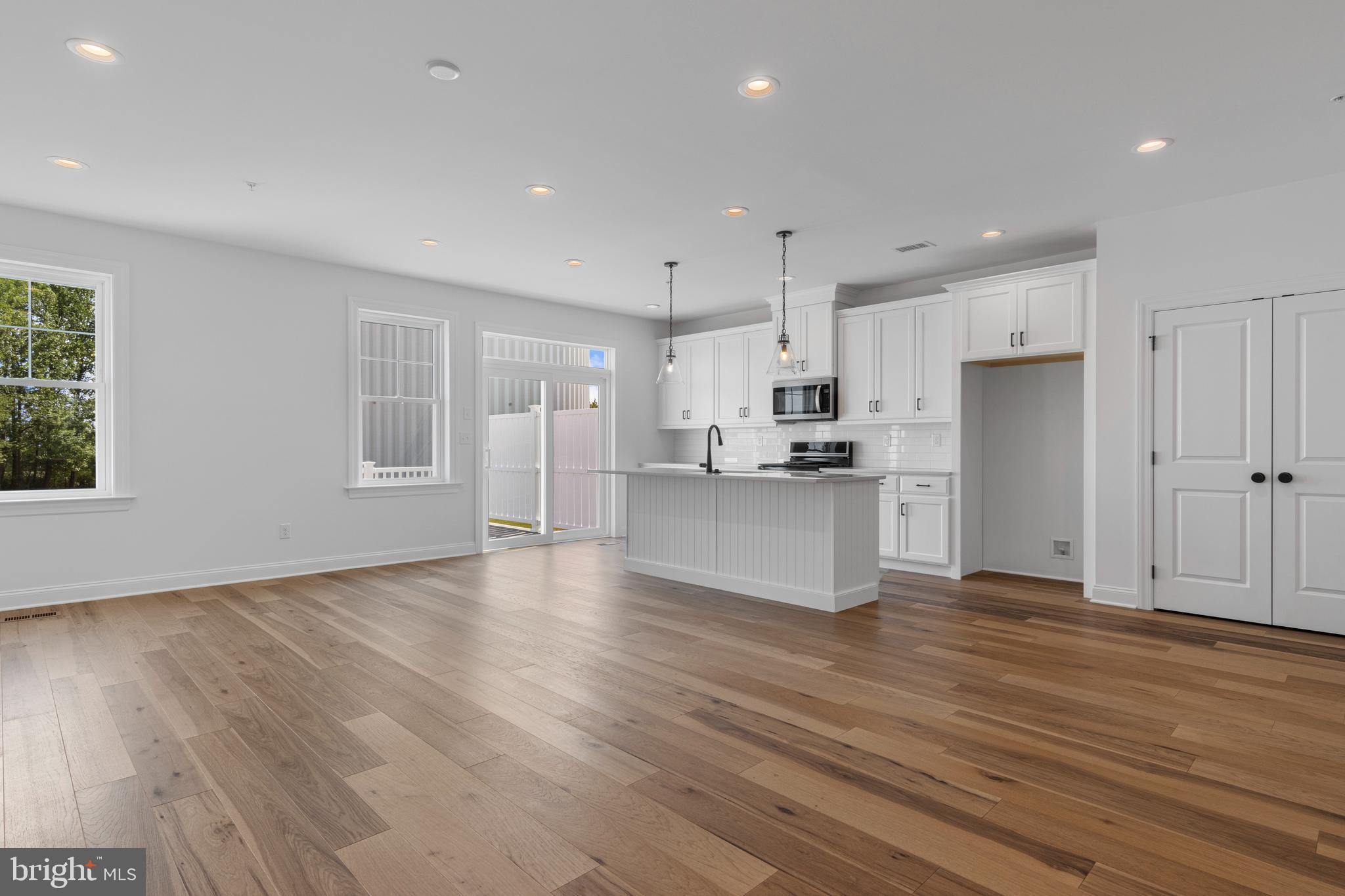 435 Reagans Lane, Unit 124 Chalfont, PA 18914 - Photo 4 of 8 a view of kitchen view wooden floor and window