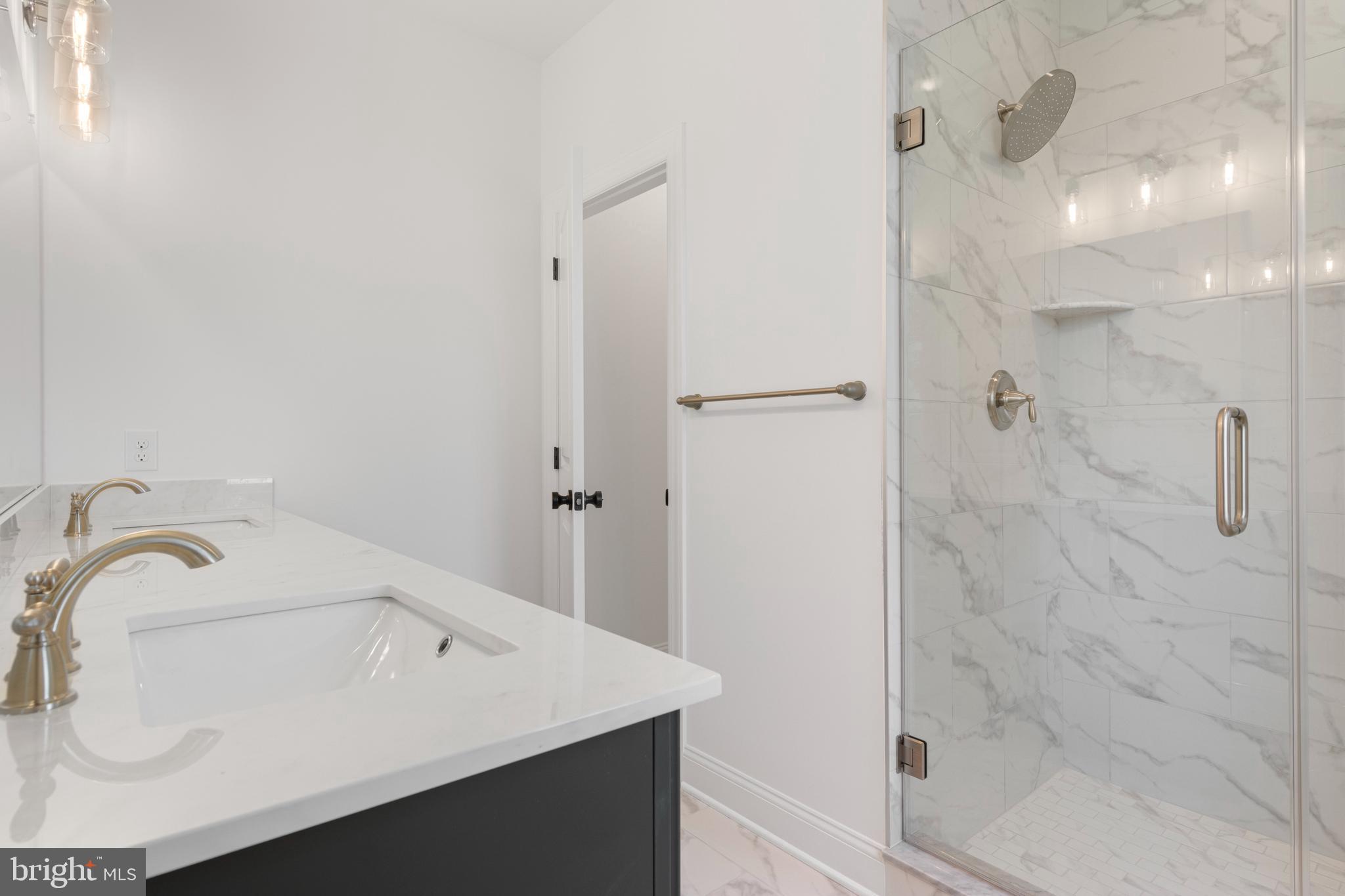 435 Reagans Lane, Unit 124 Chalfont, PA 18914 - Photo 8 of 8 a bathroom with a sink and a shower