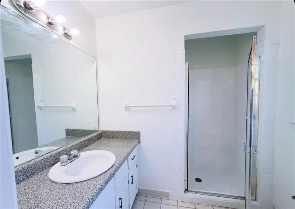 500 Rue De Chateau Stone Mountain, GA 30083 - Photo 12 of 17 a bathroom with a granite countertop sink and a mirror