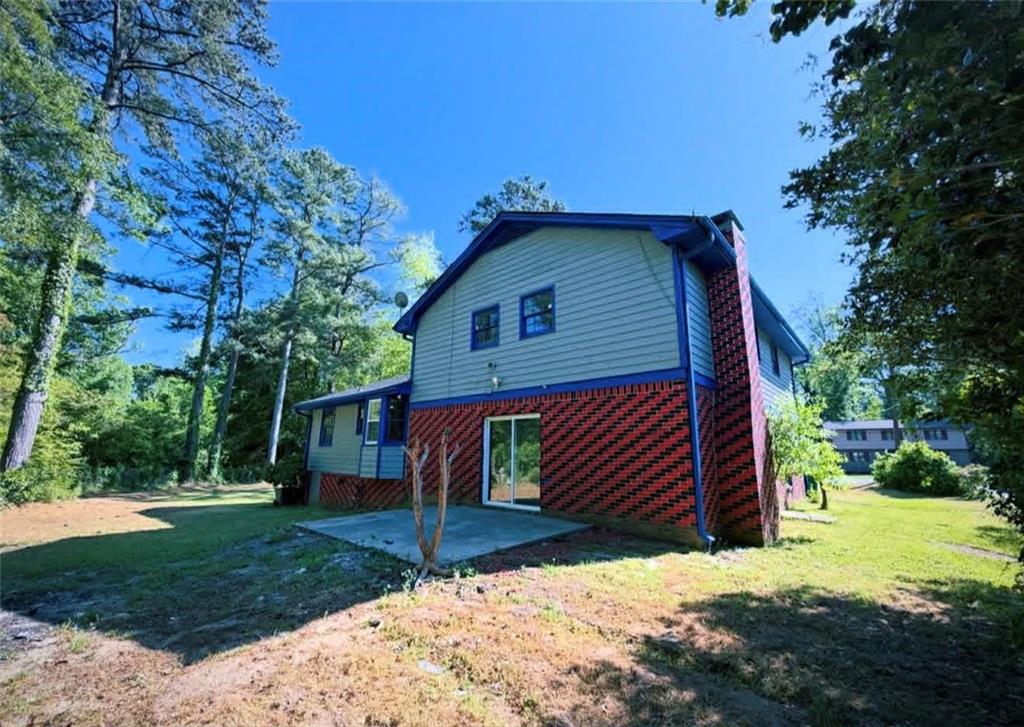 500 Rue De Chateau Stone Mountain, GA 30083 - Photo 17 of 17 a view of a house with a yard