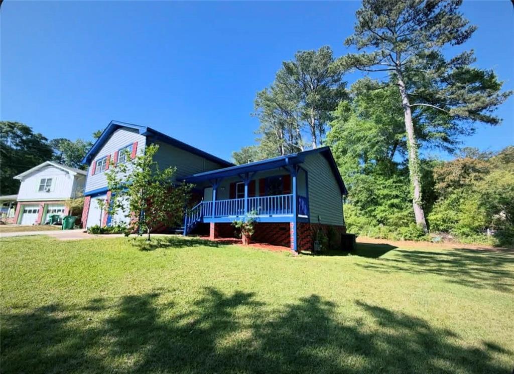 500 Rue De Chateau Stone Mountain, GA 30083 - Photo 2 of 17 a view of a house with a yard