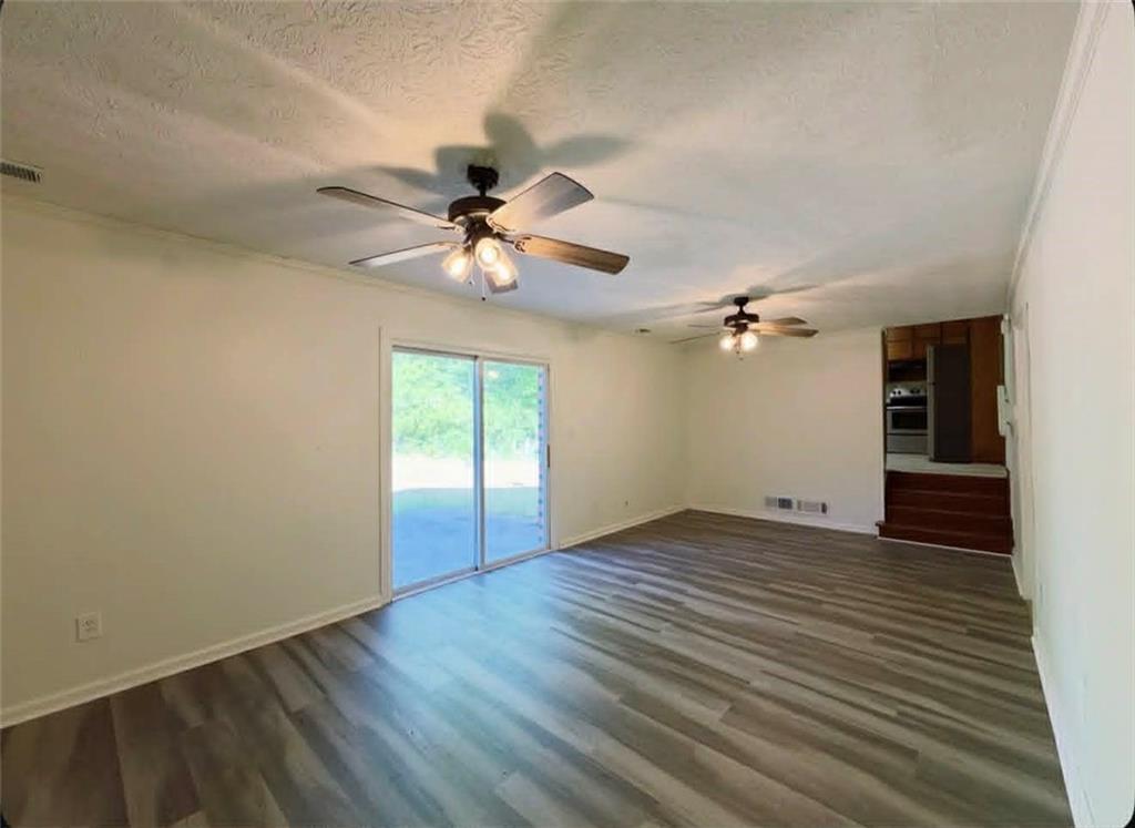 500 Rue De Chateau Stone Mountain, GA 30083 - Photo 5 of 17 wooden floor in an empty room with a window