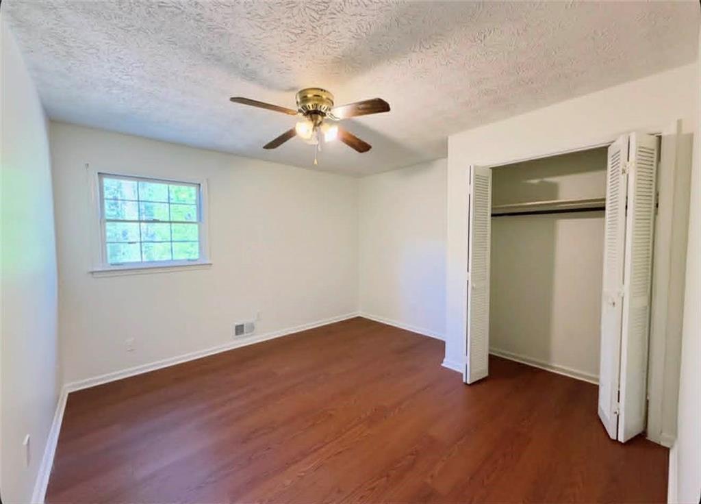 500 Rue De Chateau Stone Mountain, GA 30083 - Photo 9 of 17 an empty room with closet and windows