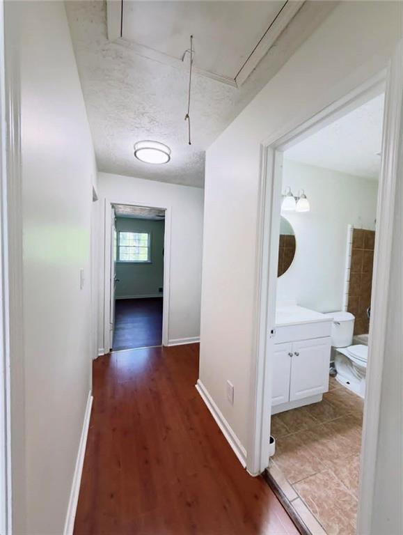 500 Rue De Chateau Stone Mountain, GA 30083 - Photo 10 of 17 an empty room with wooden floor and mirror