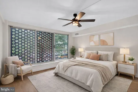 a bedroom with a bed and a couch