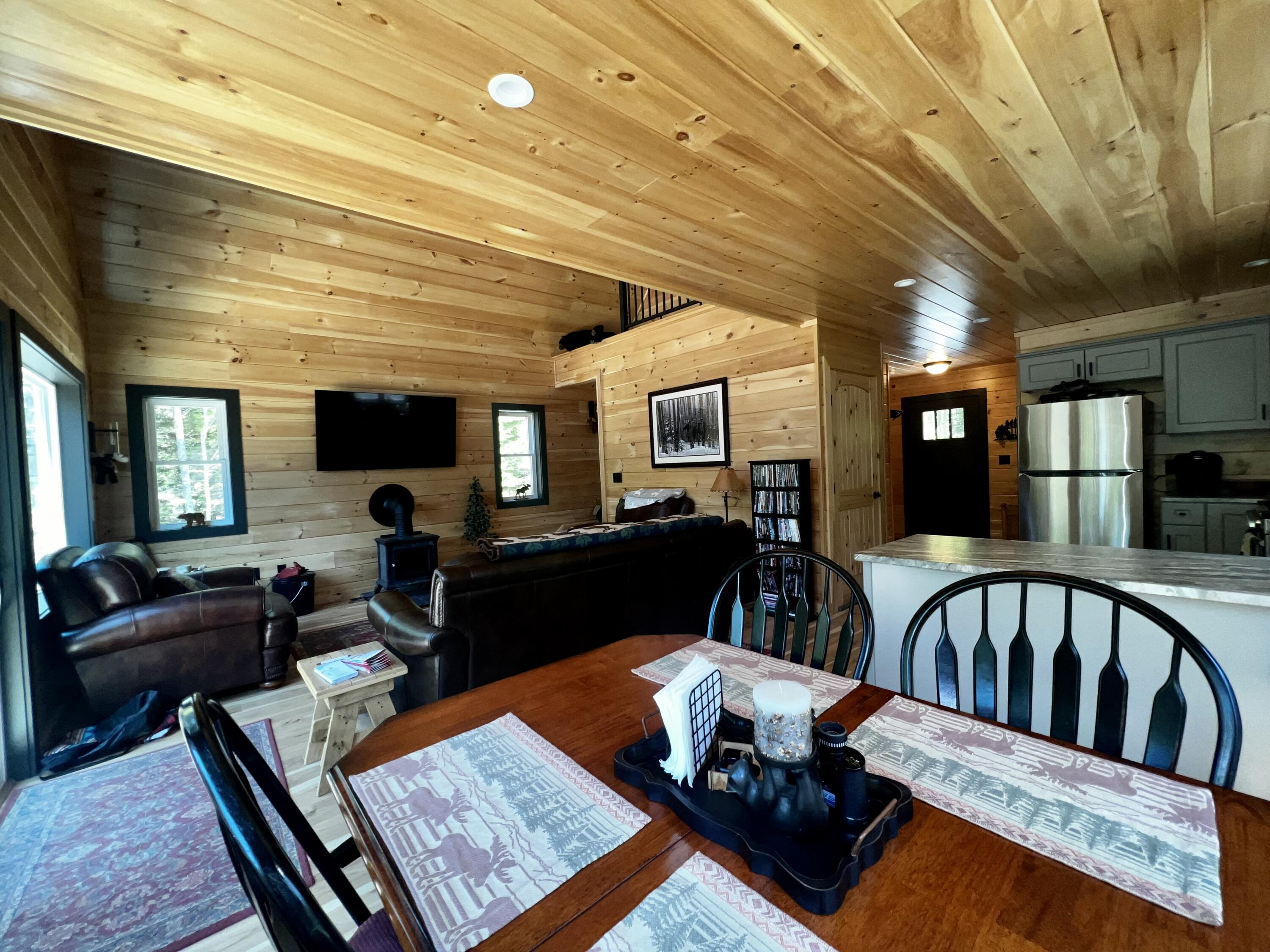 62 Winter Road Rangeley, ME 04970 - Photo 7 of 37 Dining into Living Room