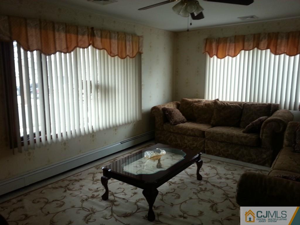 26 Winthrop Road Edison, NJ 08817 - Photo 2 of 25 a living room with furniture and a window
