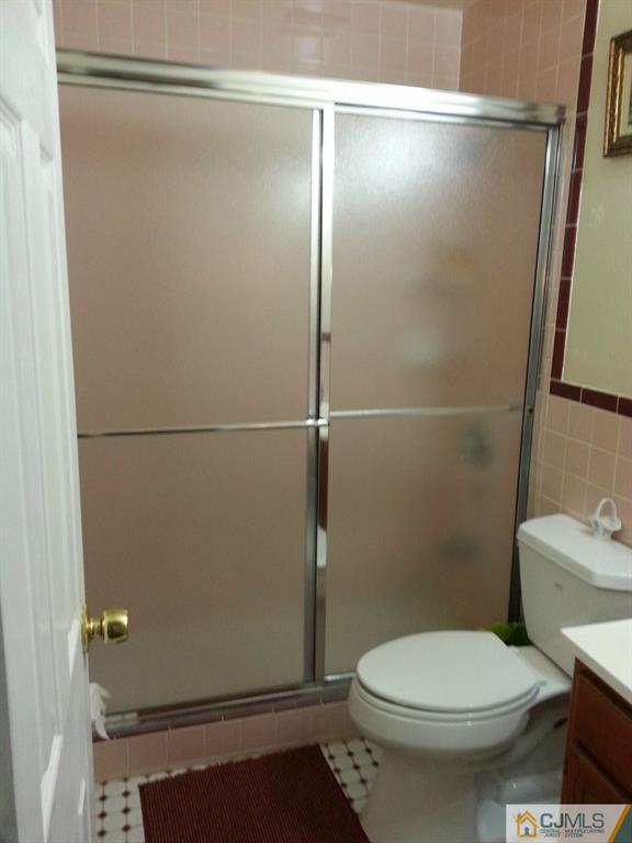 26 Winthrop Road Edison, NJ 08817 - Photo 15 of 25 a bathroom with a toilet and a shower