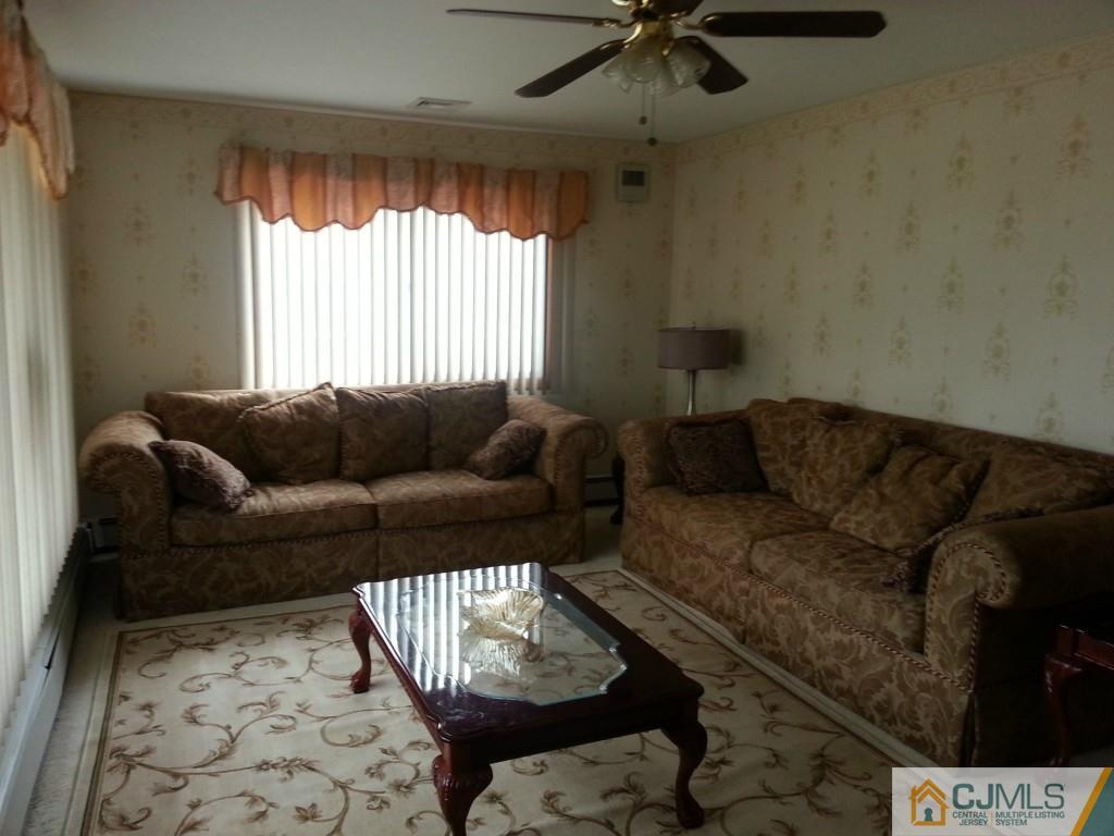 26 Winthrop Road Edison, NJ 08817 - Photo 3 of 25 a living room with furniture and a window
