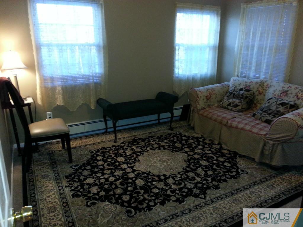 26 Winthrop Road Edison, NJ 08817 - Photo 10 of 25 a living room with furniture and a window