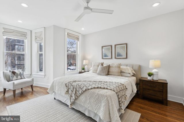 a bedroom with a bed and a couch