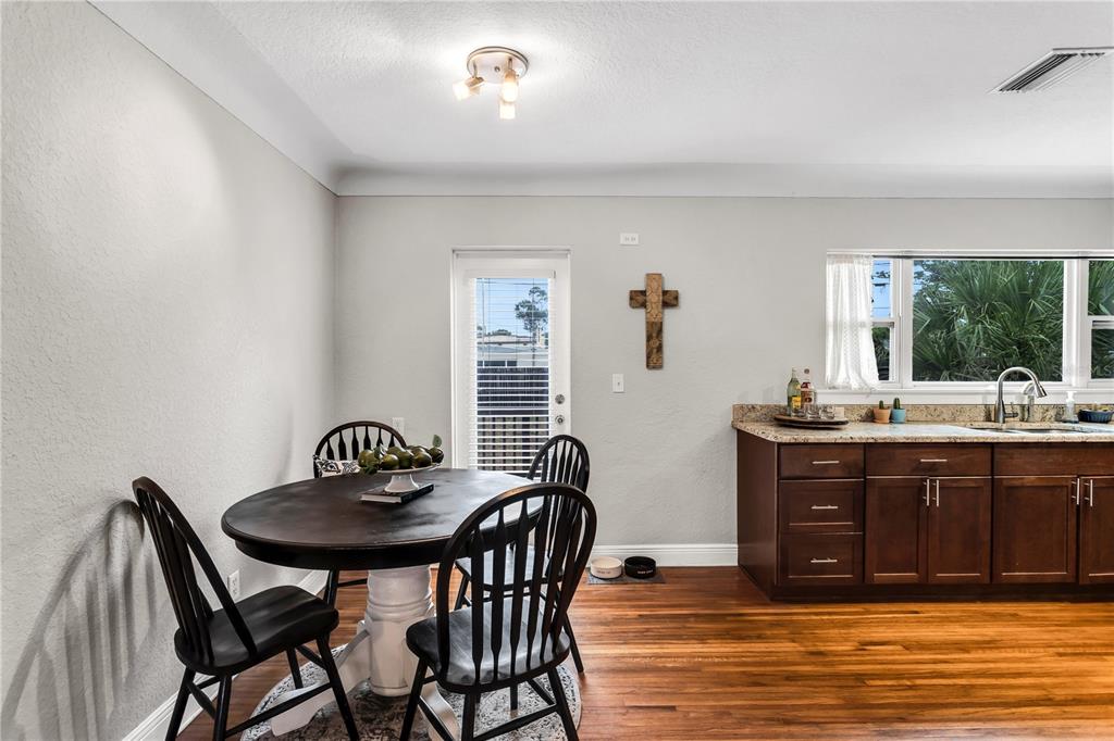 2425 36th Avenue North St. Petersburg, FL 33713 - Photo 11 of 32 a view of a dining room with furniture and window